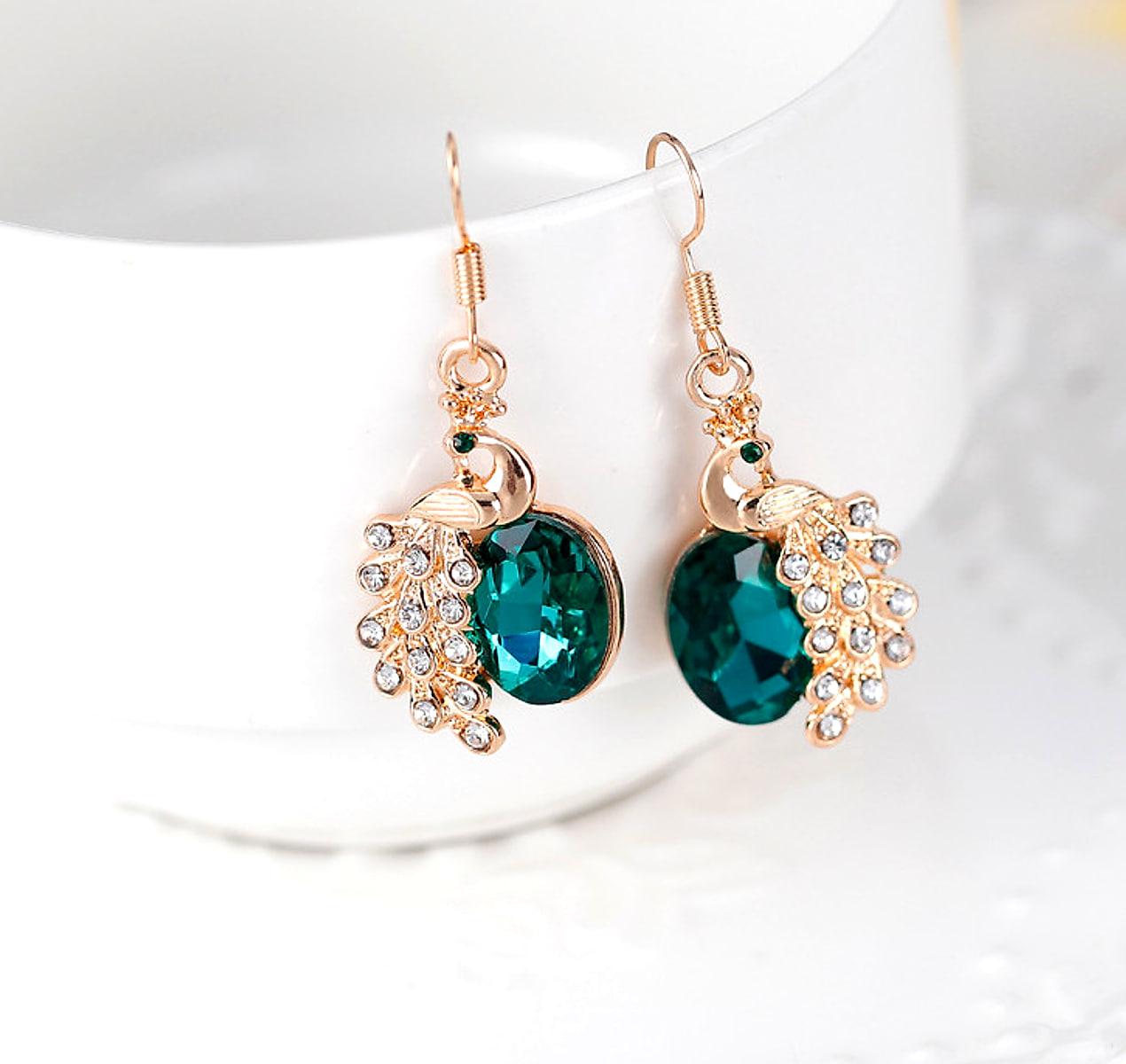 Halsband och örhängen med påfågel – strass