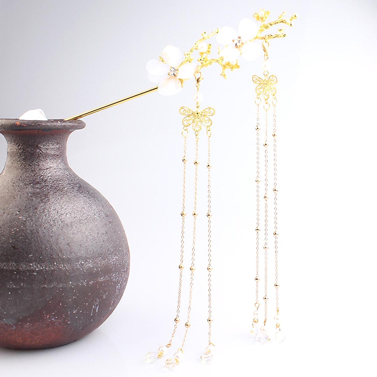 Hårnål med plommonblommor och tofsar – guld- eller silverfärgad